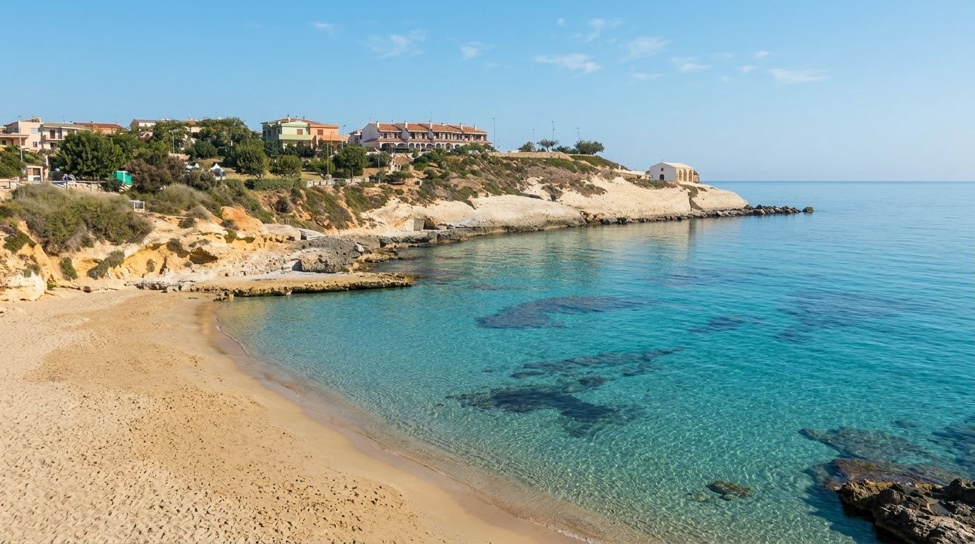 Balai, Porto Torres — caletta con sabbia dorata, scogli e mare turchese