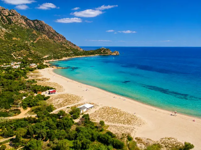 Foxi Manna, Tertenia — vista aerea della lunga spiaggia sabbiosa alla foce del rio con mare turchese